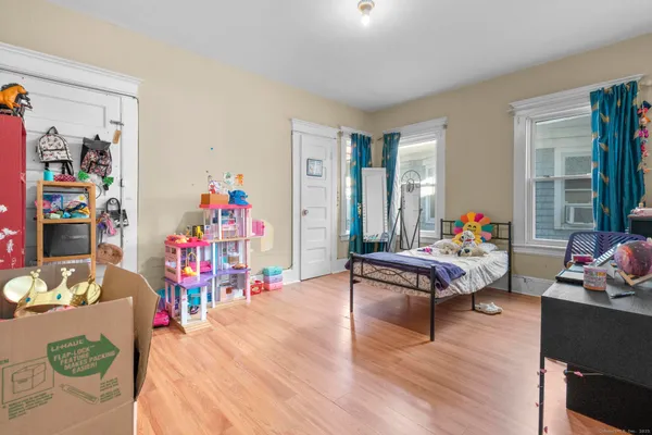a view of an entryway with wooden floor