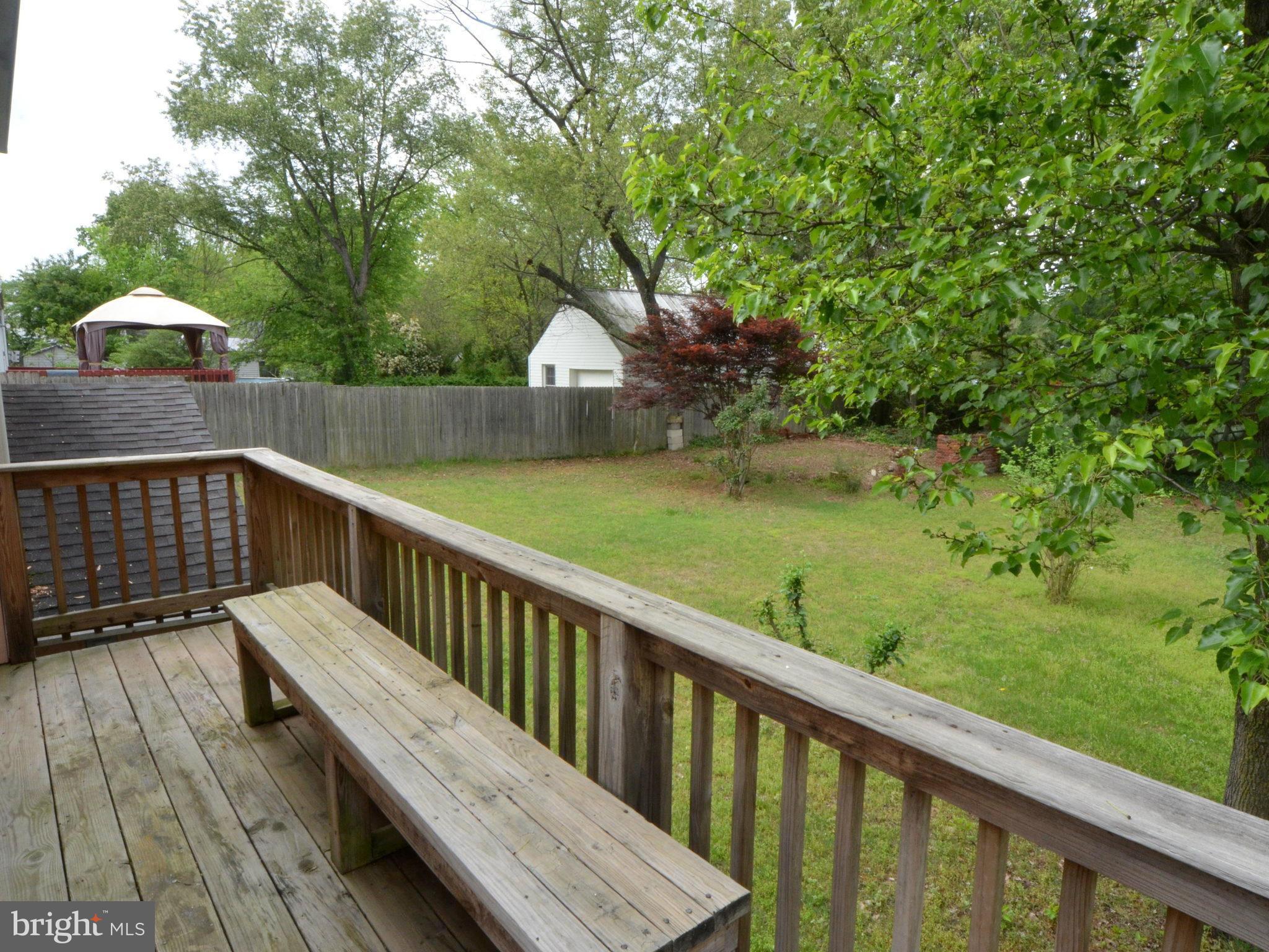 6720 Larkspur Road Morningside, MD 20746 - Photo 17 of 29 a view of balcony with wooden floor and outdoor seating