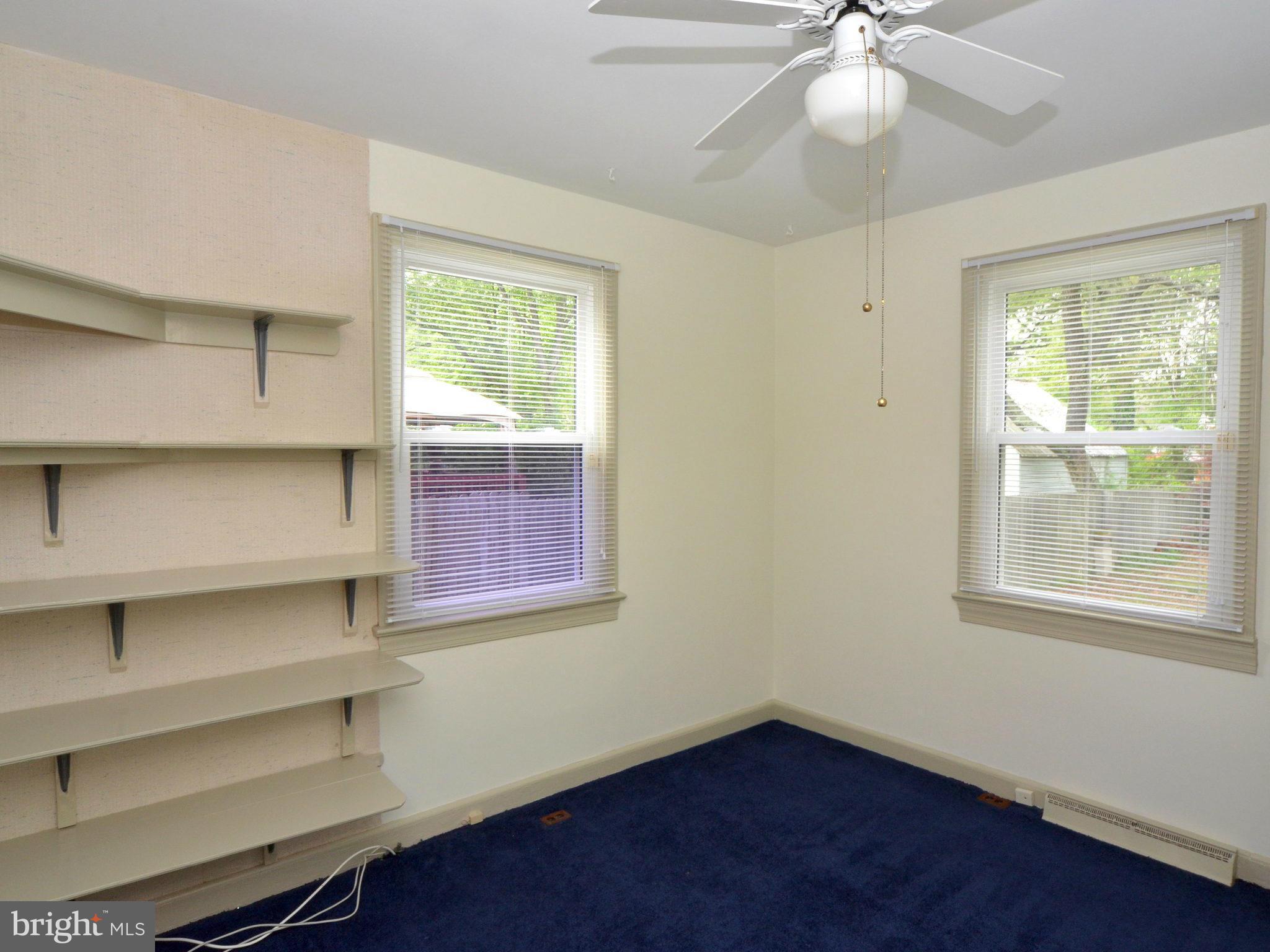 6720 Larkspur Road Morningside, MD 20746 - Photo 18 of 29 a view of an empty room with a window and wooden floor