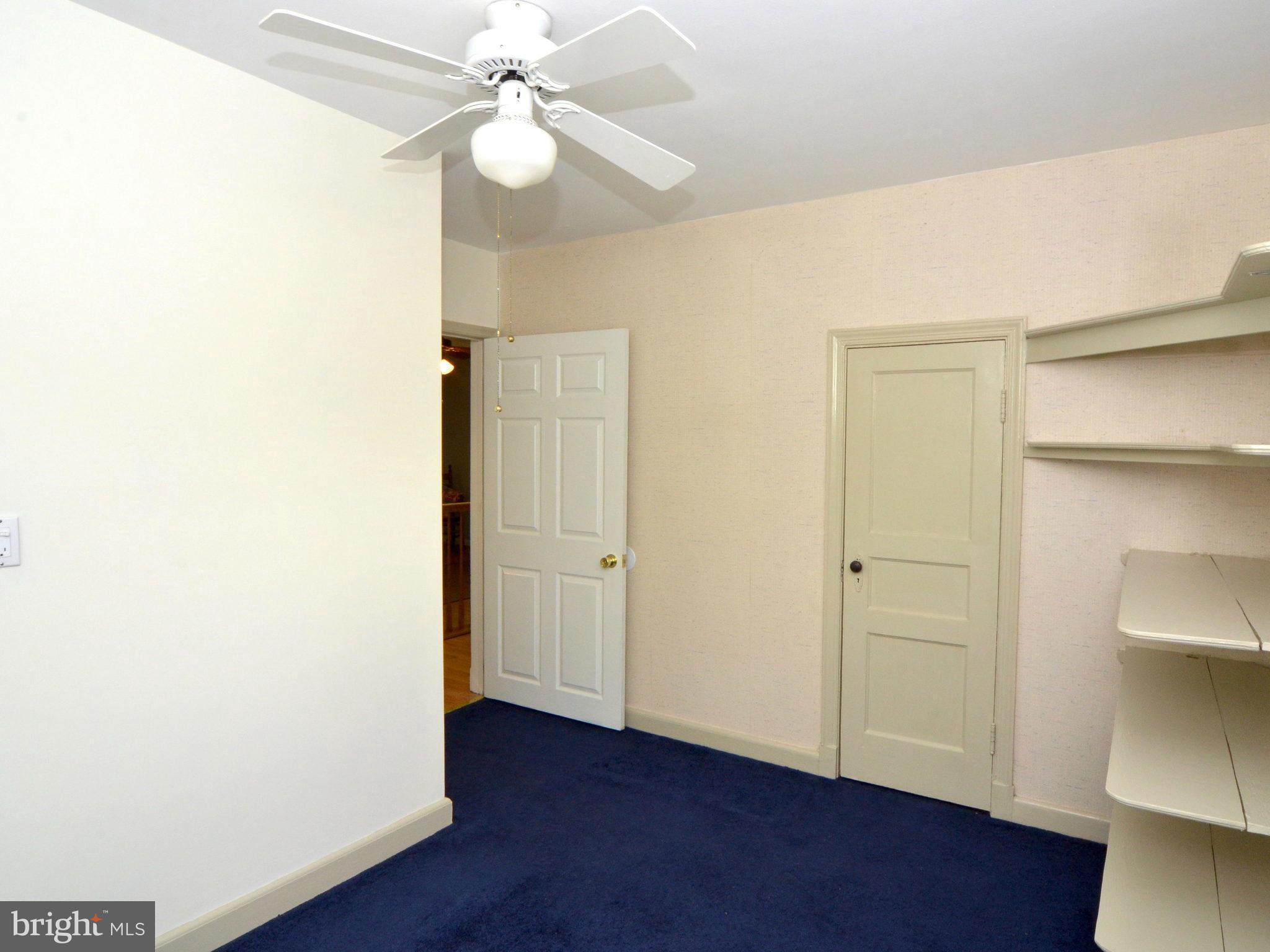 6720 Larkspur Road Morningside, MD 20746 - Photo 19 of 29 a view of an empty room with wooden floor