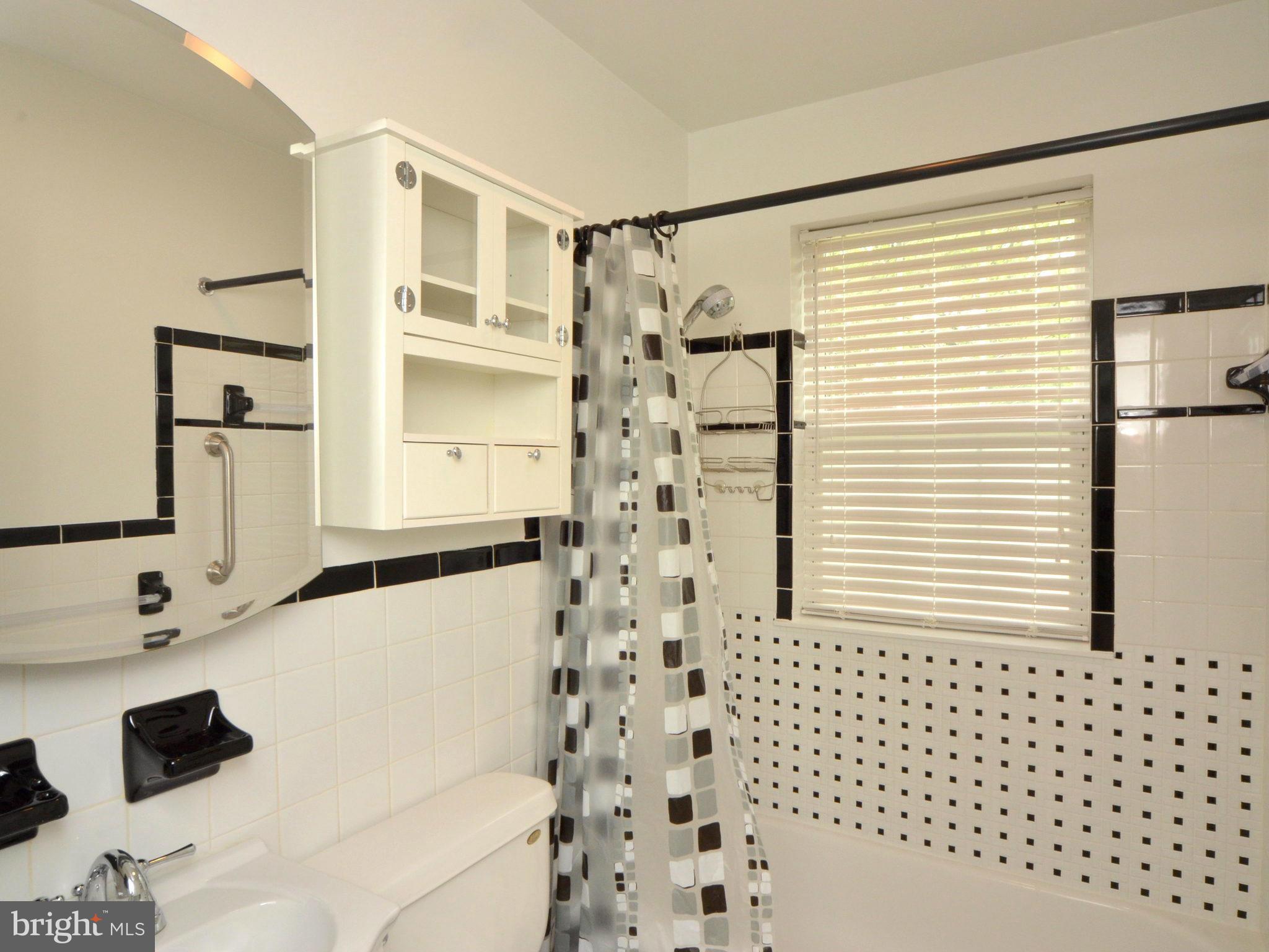 6720 Larkspur Road Morningside, MD 20746 - Photo 20 of 29 a bathroom with a sink and a shower