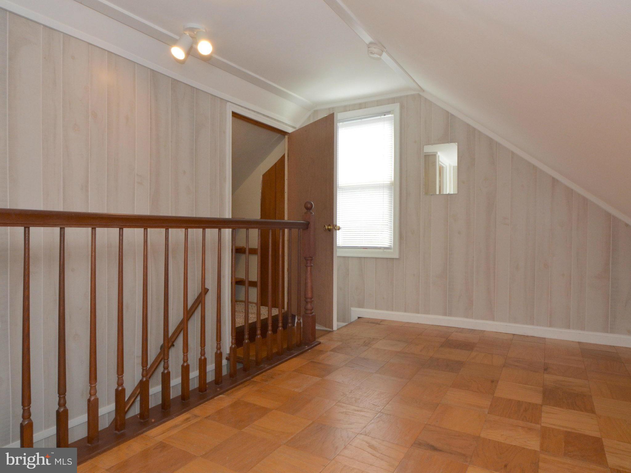 6720 Larkspur Road Morningside, MD 20746 - Photo 21 of 29 a view of entryway with wooden floor