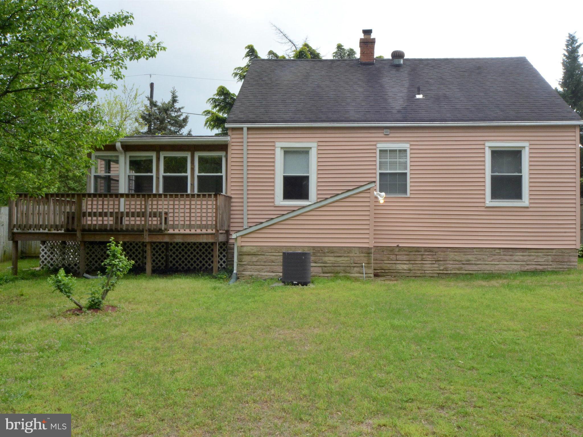 6720 Larkspur Road Morningside, MD 20746 - Photo 27 of 29 a front view of a house with a yard