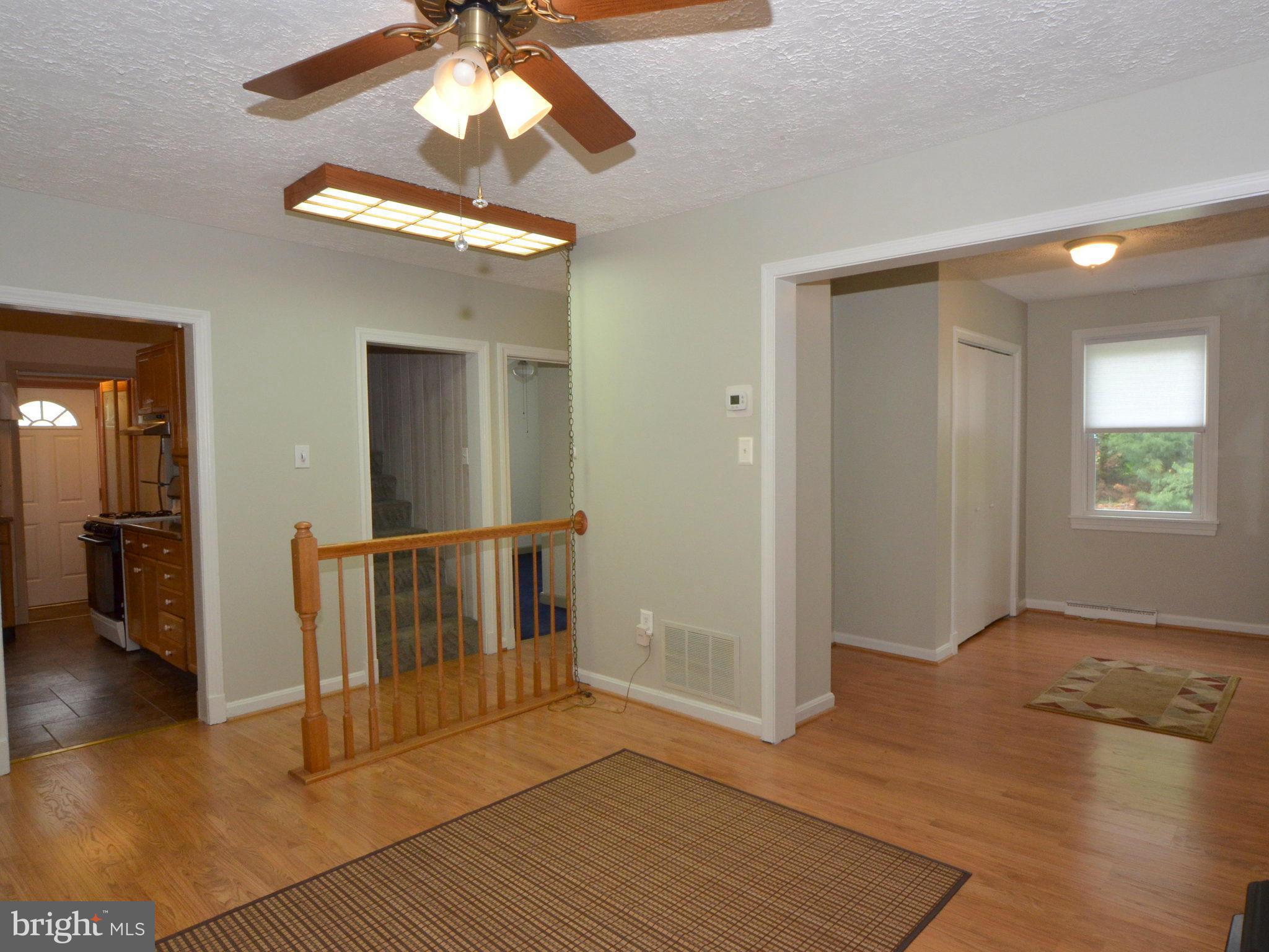 6720 Larkspur Road Morningside, MD 20746 - Photo 6 of 29 wooden floor in an empty room with a window