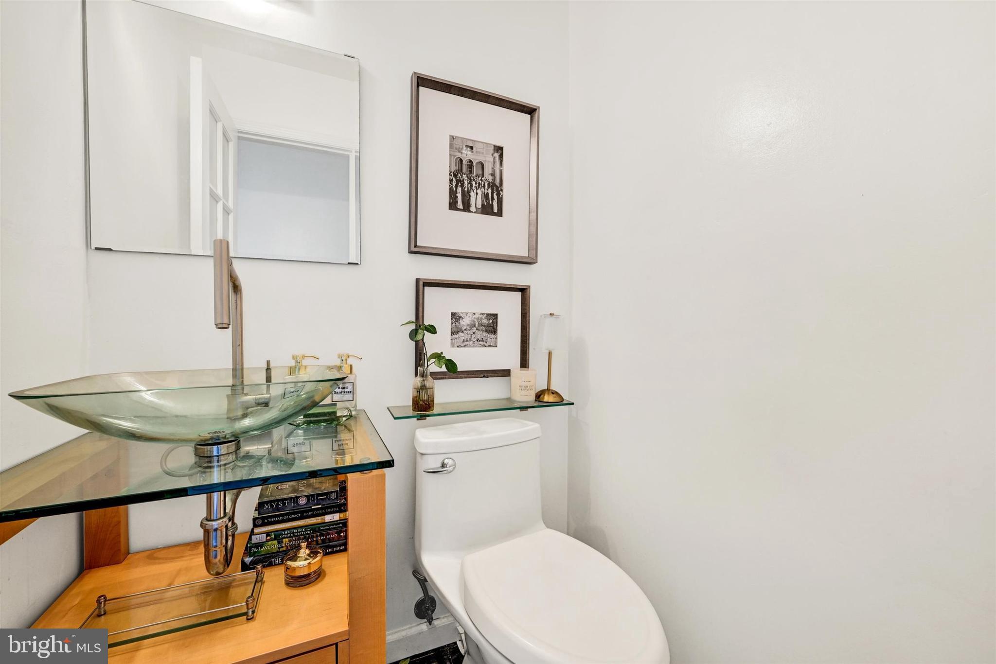 9206 Muskogee Place Adelphi, MD 20783 - Photo 20 of 43 a bathroom with a toilet a sink and mirror