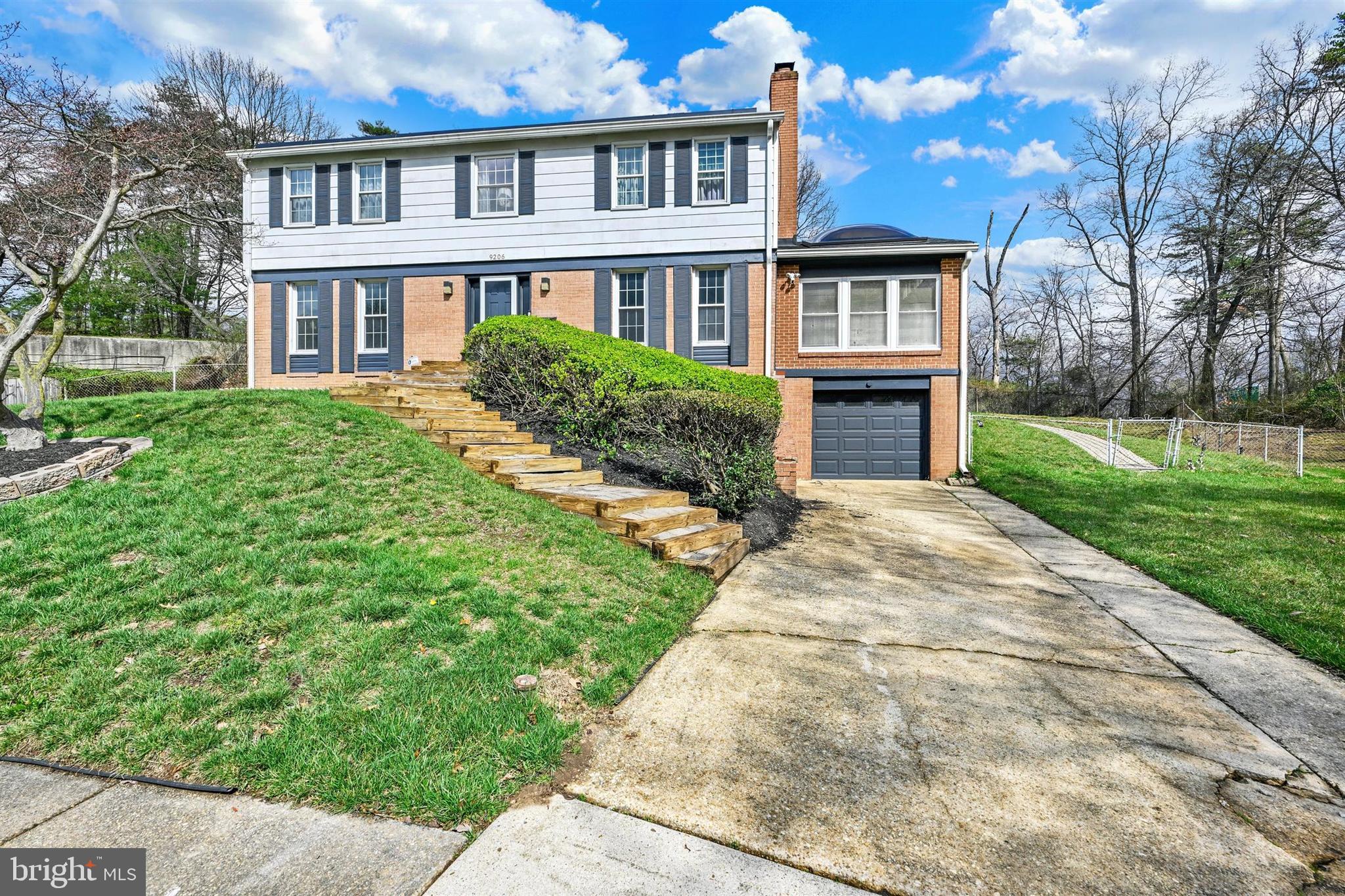 9206 Muskogee Place Adelphi, MD 20783 - Photo 2 of 43 a front view of a house with yard and green space