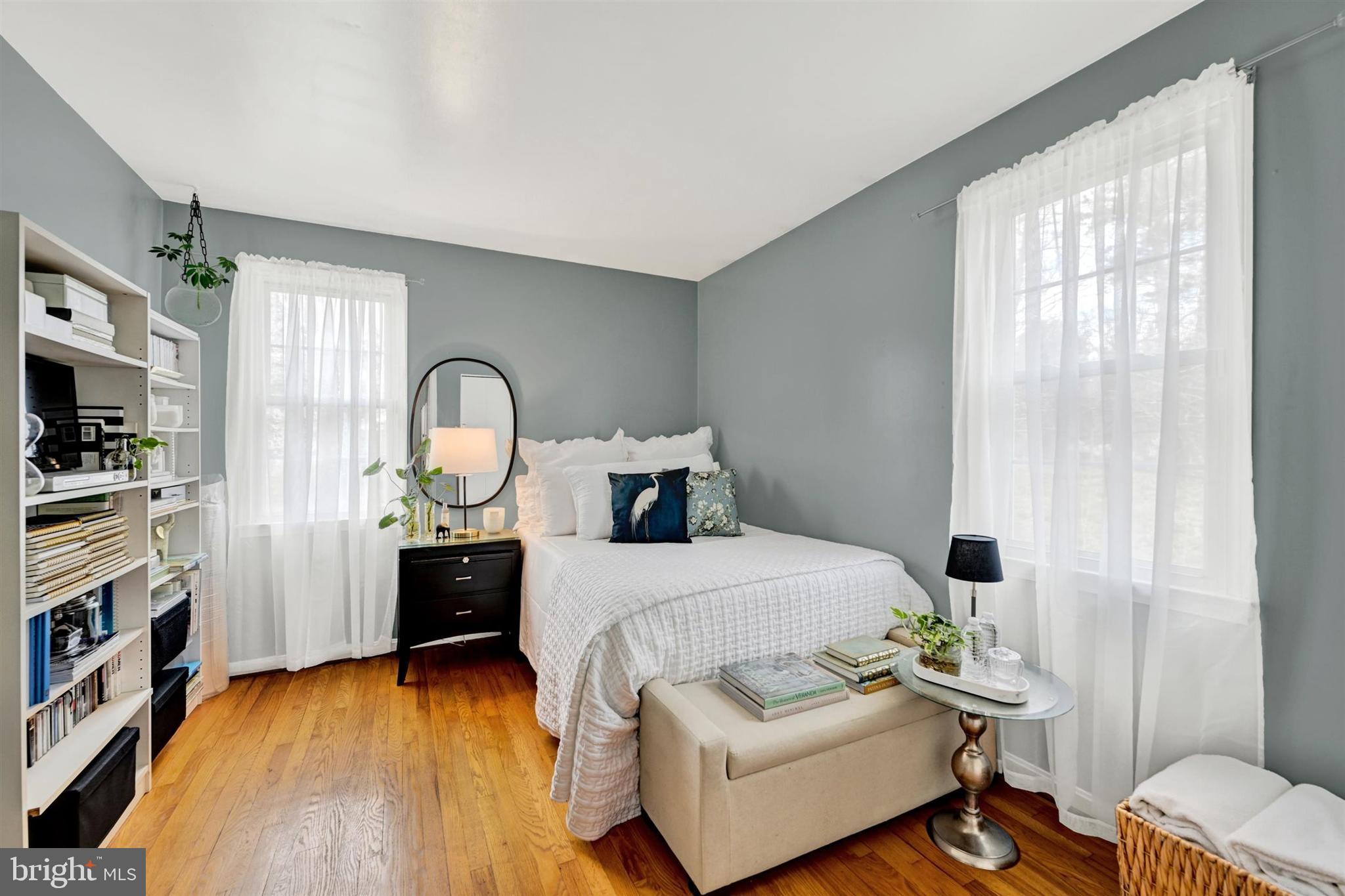 9206 Muskogee Place Adelphi, MD 20783 - Photo 25 of 43 a bedroom with a bed and a flat tv screen on the dresser