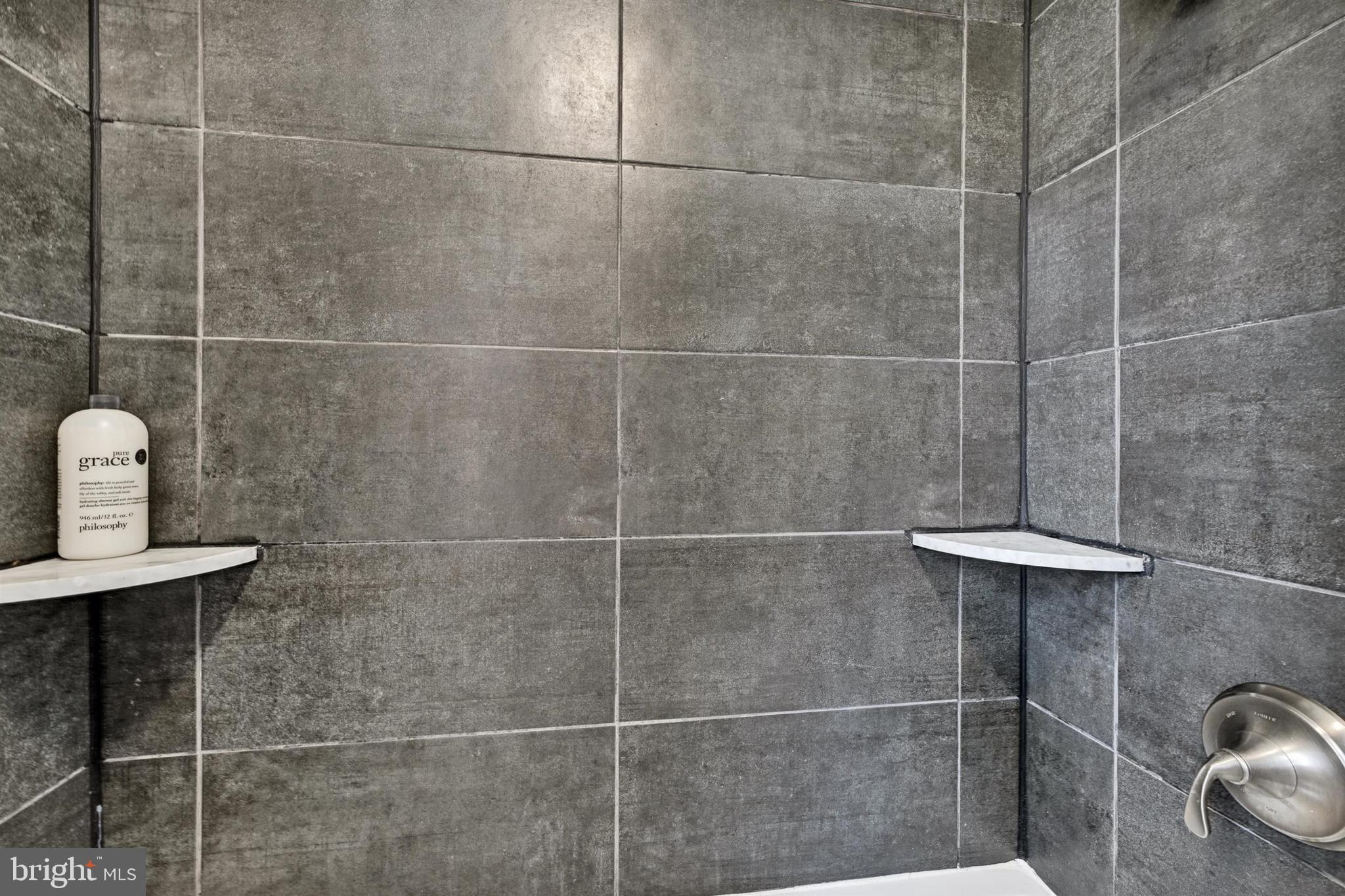 9206 Muskogee Place Adelphi, MD 20783 - Photo 27 of 43 a bathroom with a shower