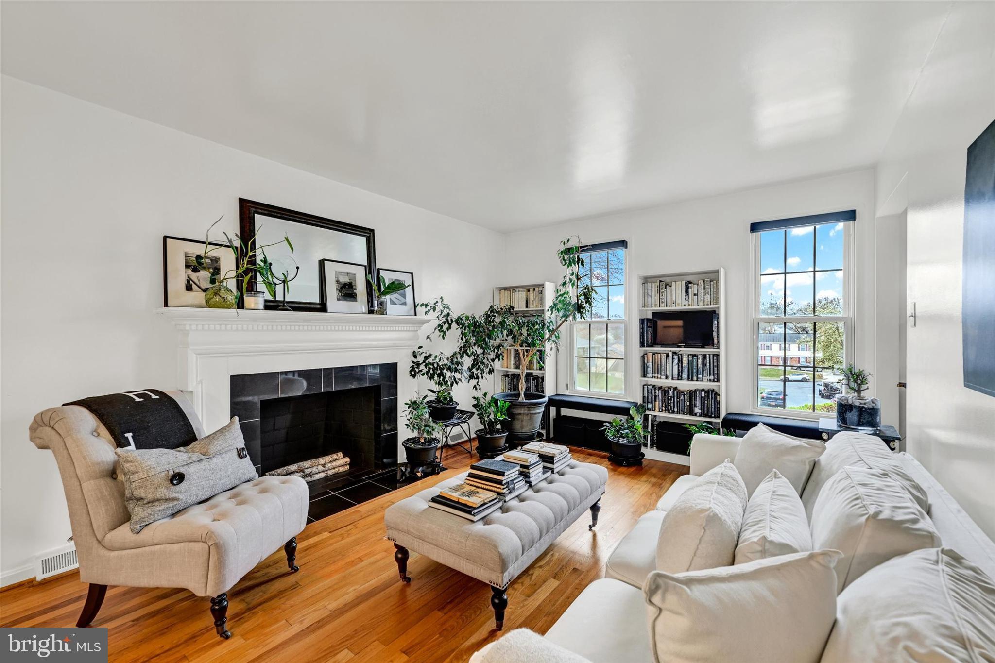 9206 Muskogee Place Adelphi, MD 20783 - Photo 3 of 43 a living room with furniture fireplace and a large window