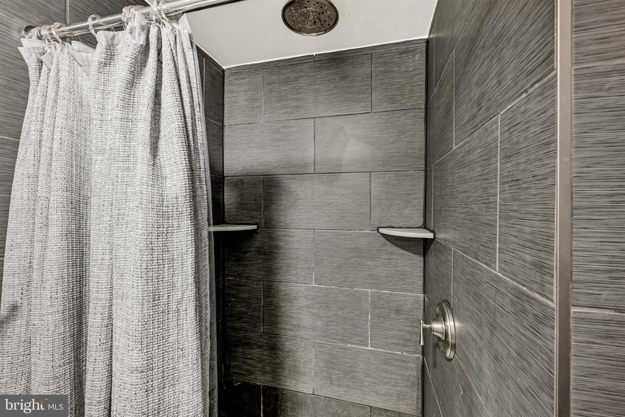 9206 Muskogee Place Adelphi, MD 20783 - Photo 32 of 43 a bathroom with a shower
