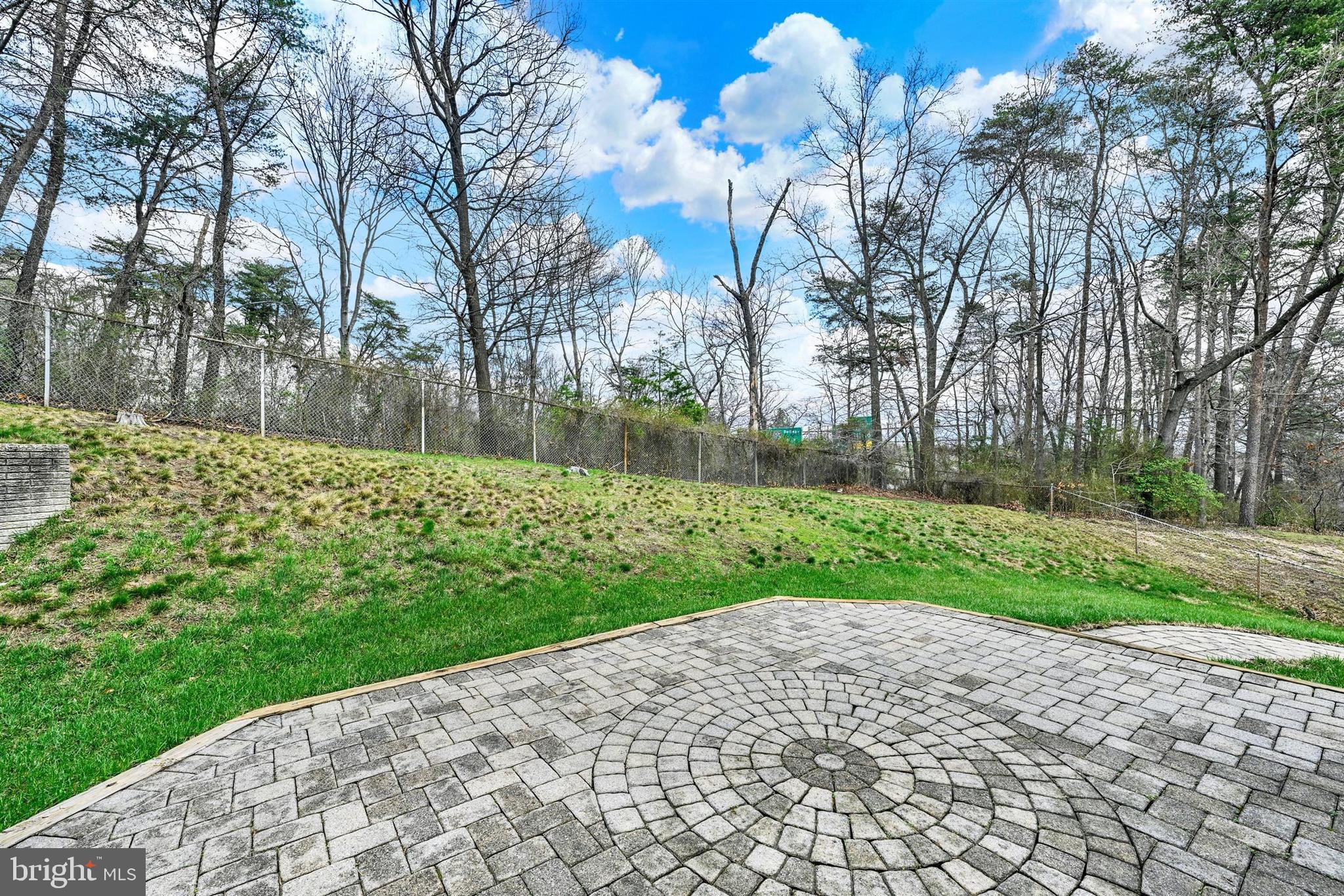 9206 Muskogee Place Adelphi, MD 20783 - Photo 36 of 43 a view of a backyard with large trees