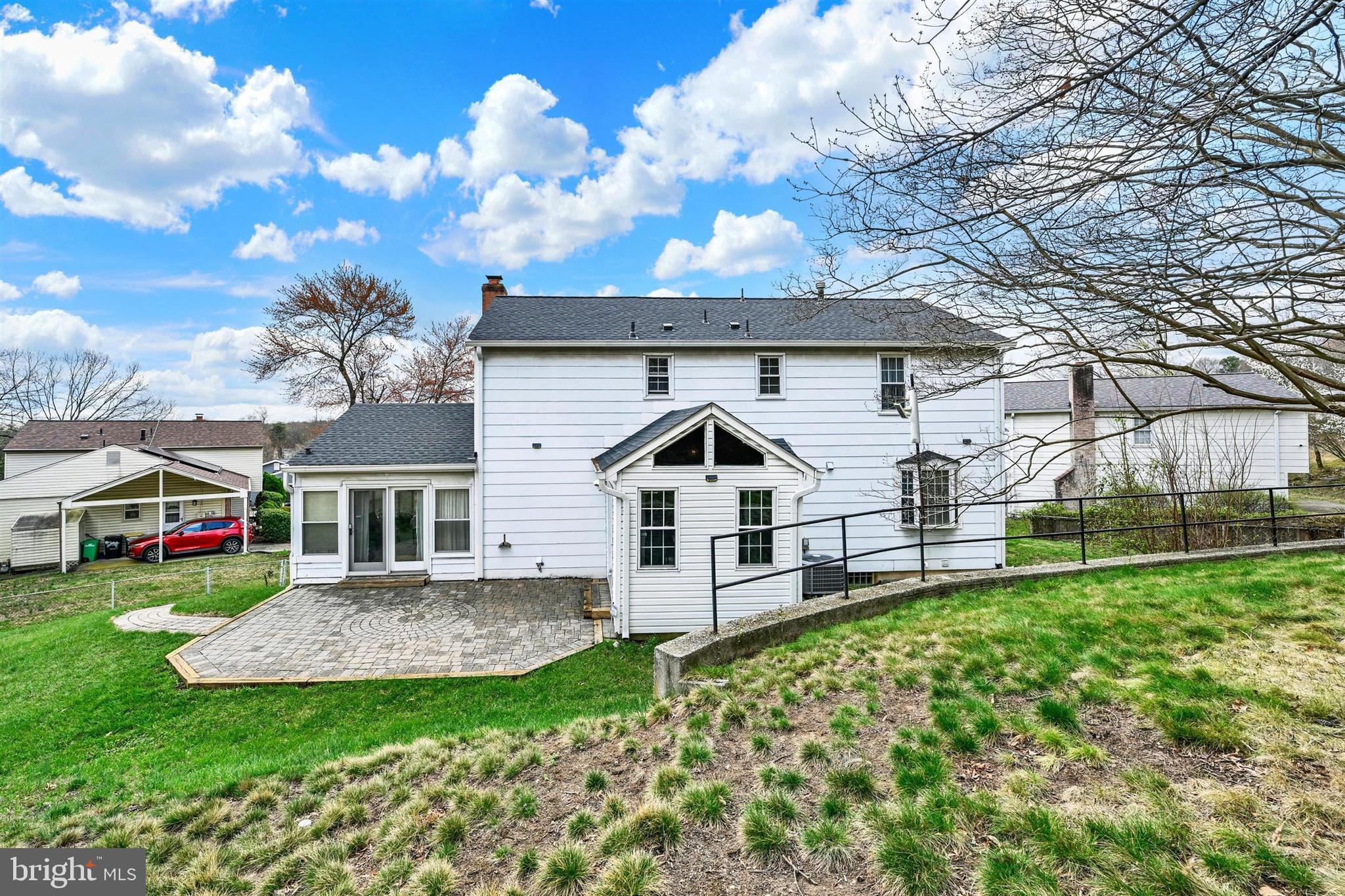 9206 Muskogee Place Adelphi, MD 20783 - Photo 37 of 43 a front view of a house with a yard and garage