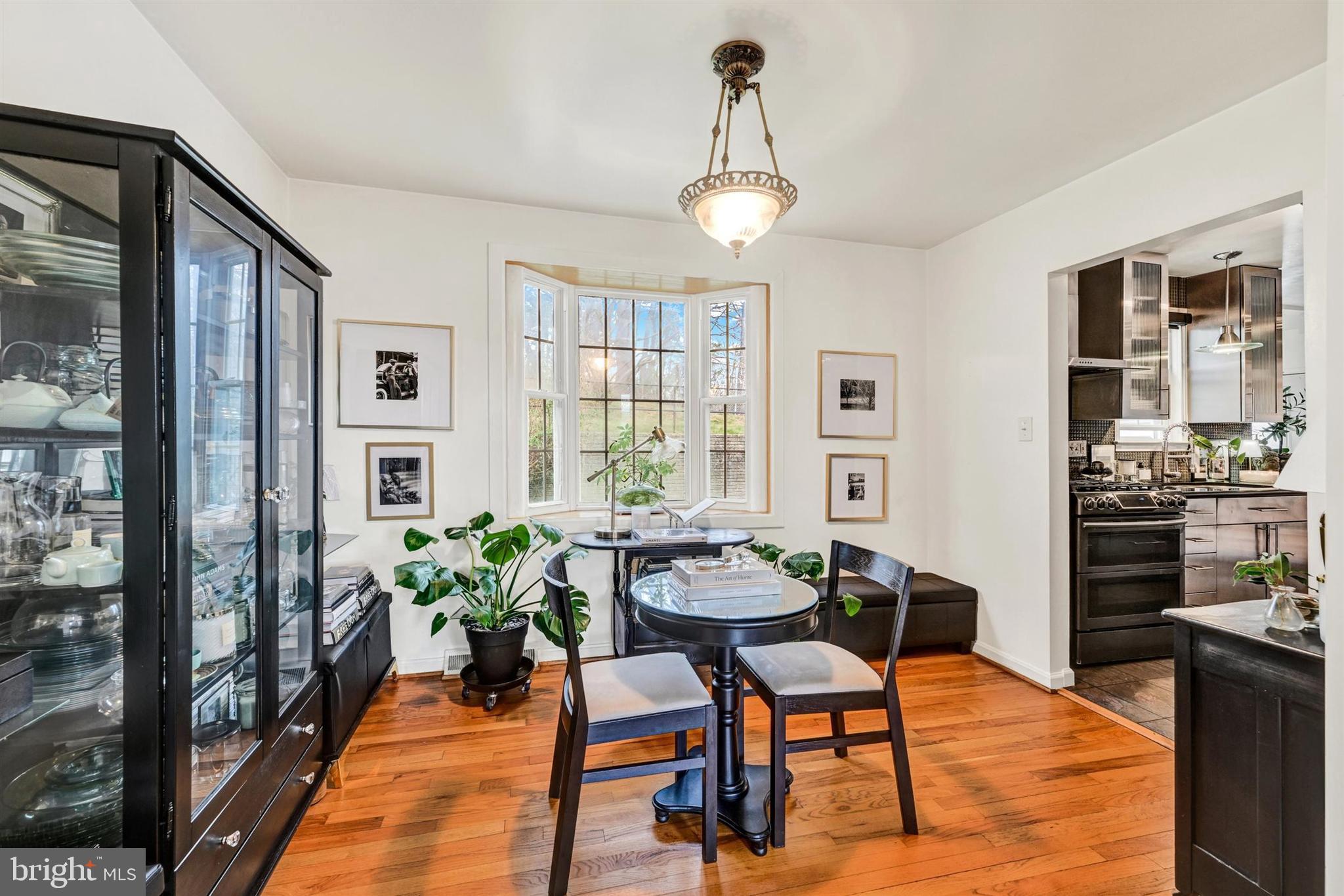 9206 Muskogee Place Adelphi, MD 20783 - Photo 9 of 43 a view of a dining room with furniture window and wooden floor