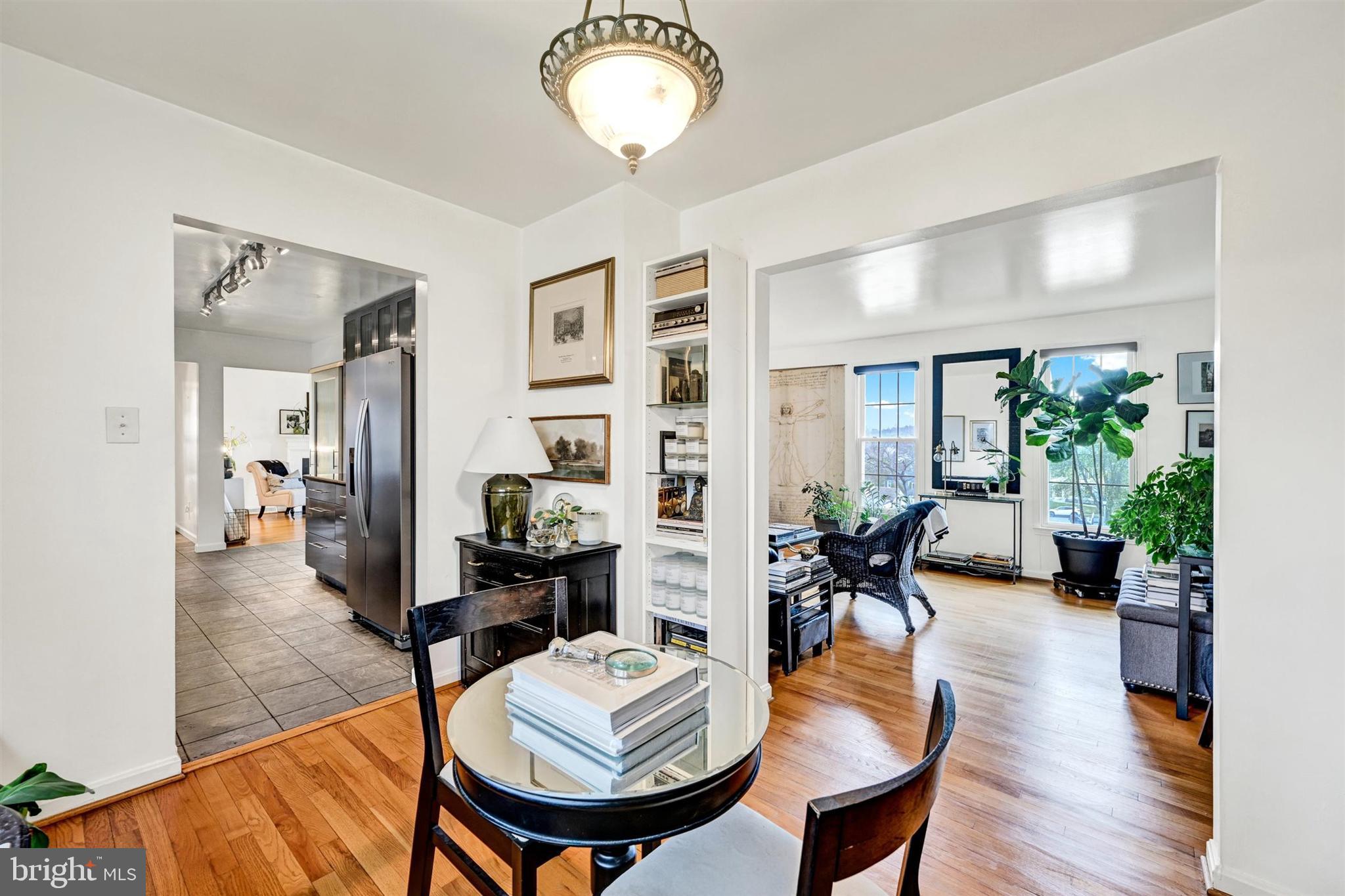 9206 Muskogee Place Adelphi, MD 20783 - Photo 10 of 43 a view of a dining room with furniture window and wooden floor