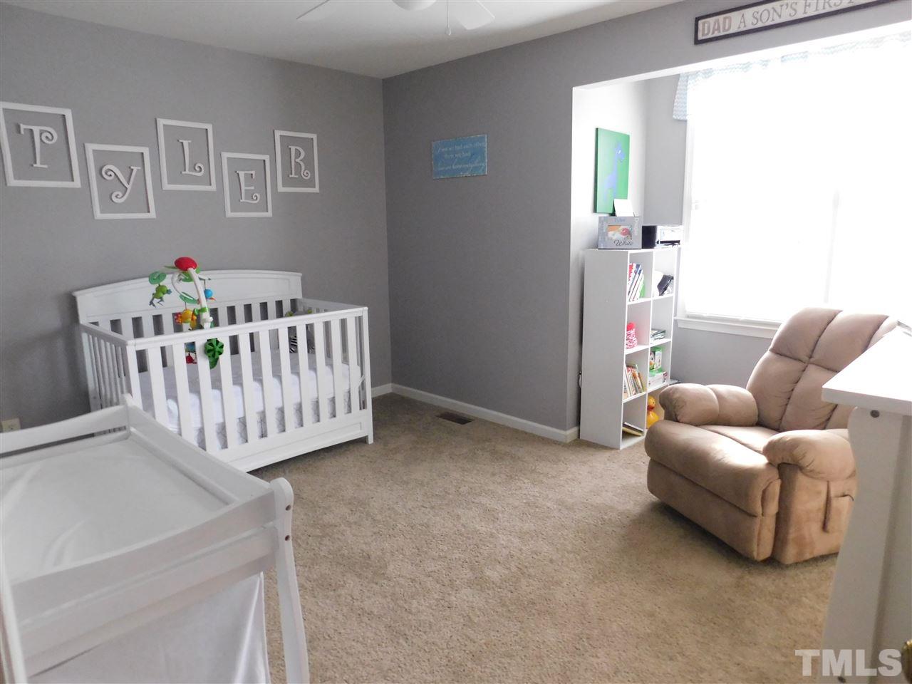 4428 Roller Court Raleigh, NC 27604 - Photo 10 of 10 a bedroom with furniture and a bed