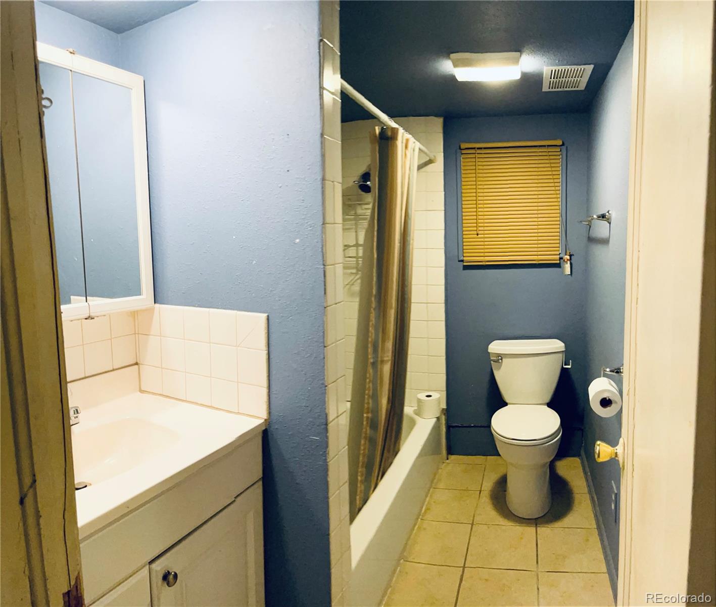 317 9th Street Gilcrest, CO 80623 - Photo 13 of 15 a bathroom with a toilet and a sink