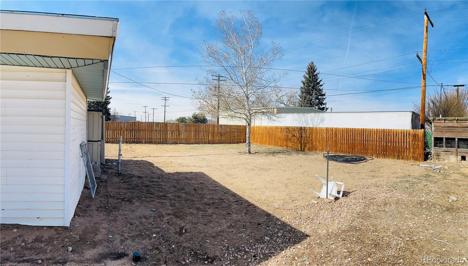 317 9th Street Gilcrest, CO 80623 - Photo 15 of 15 a view of a backyard of the house