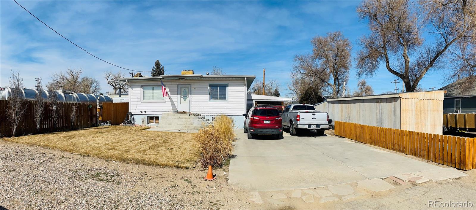317 9th Street Gilcrest, CO 80623 - Photo 2 of 15 a view of a house with a patio