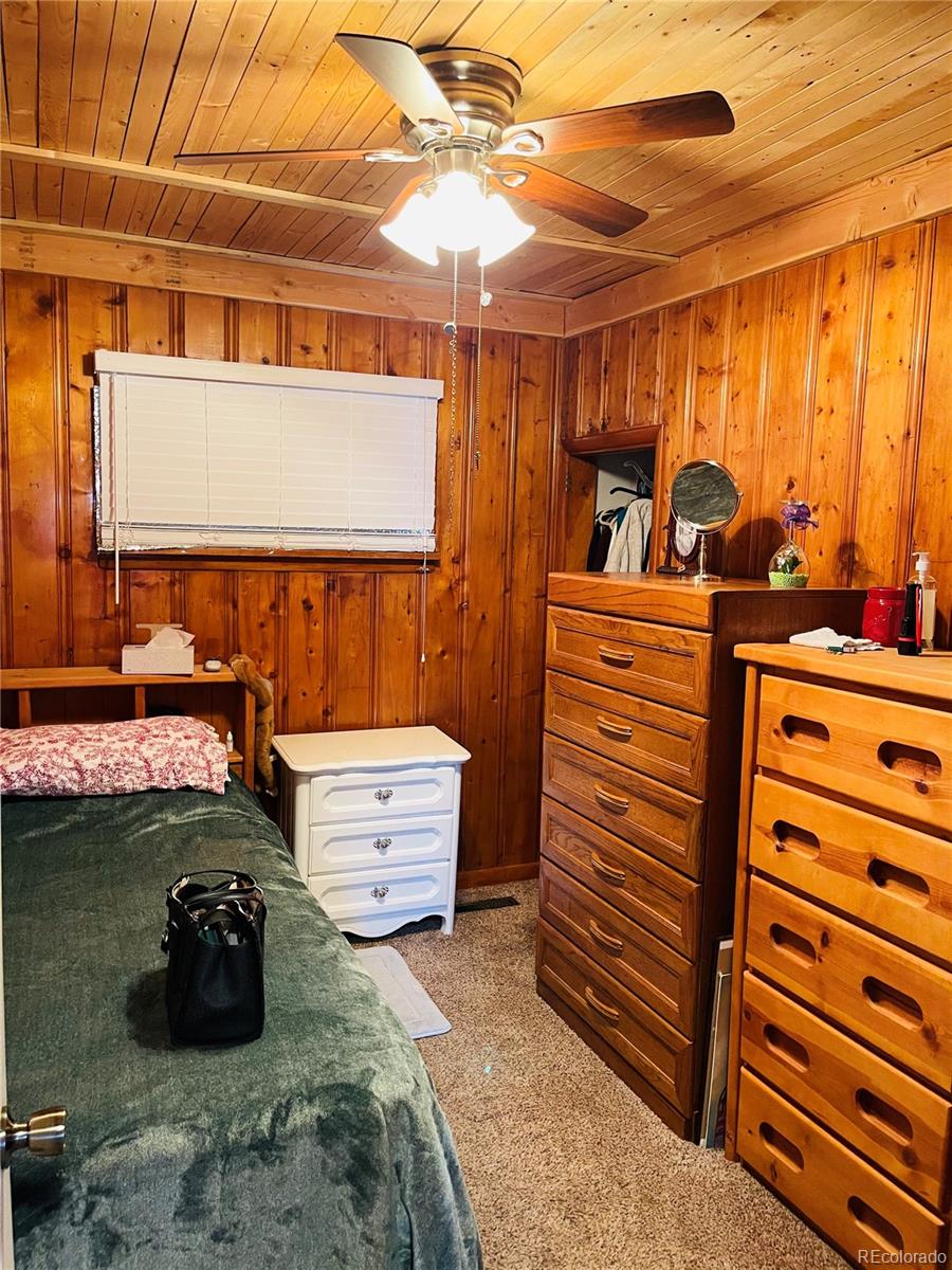 317 9th Street Gilcrest, CO 80623 - Photo 5 of 15 a room with furniture and a window