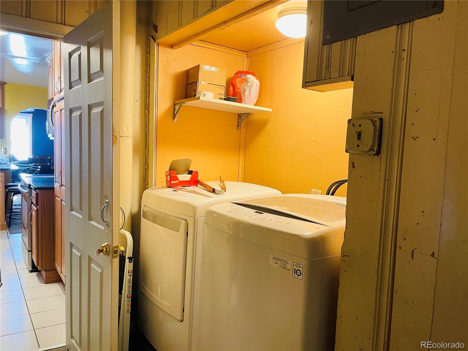 317 9th Street Gilcrest, CO 80623 - Photo 9 of 15 a utility room with dryer and washer
