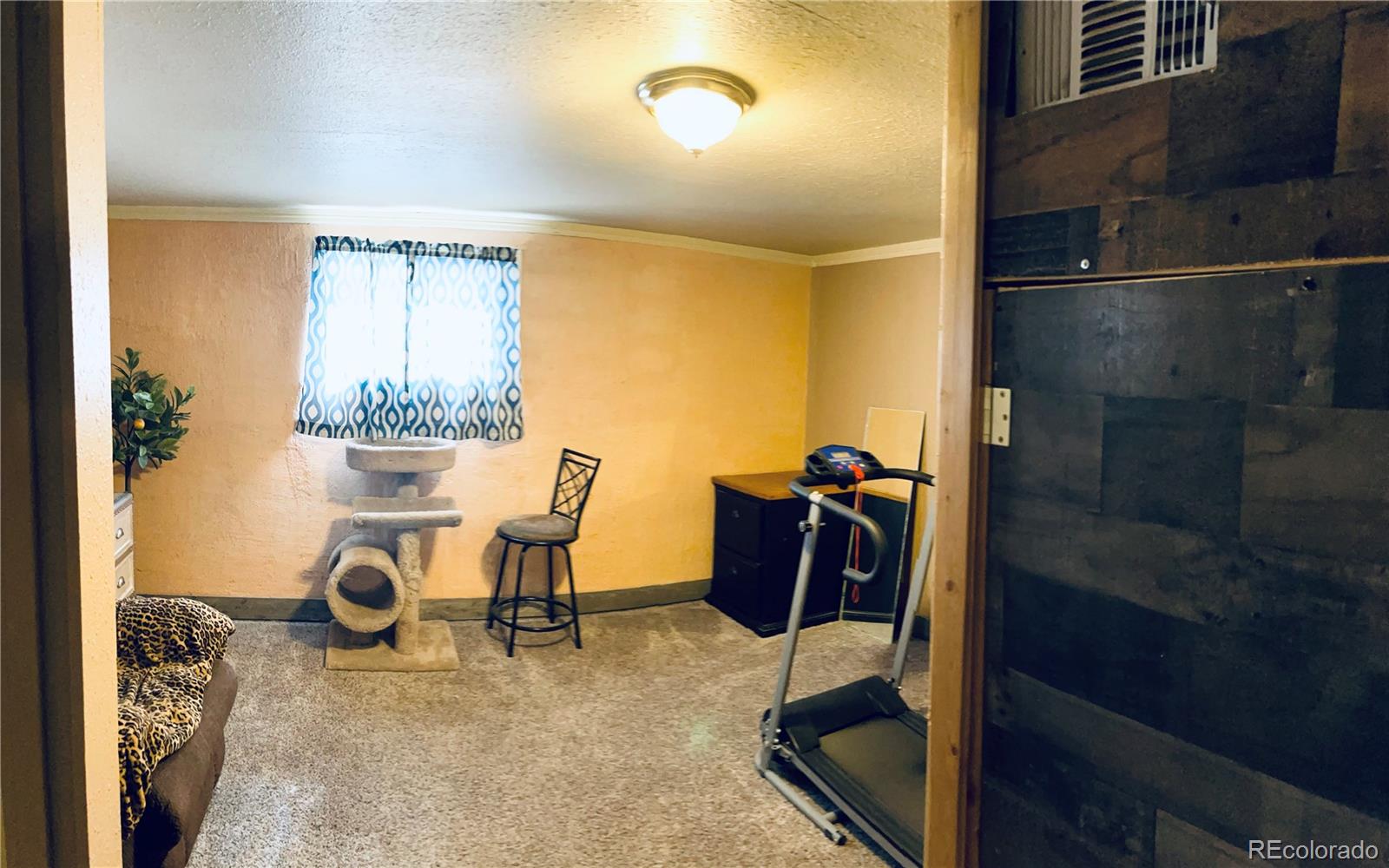 317 9th Street Gilcrest, CO 80623 - Photo 10 of 15 a view of a workspace with furniture and a window