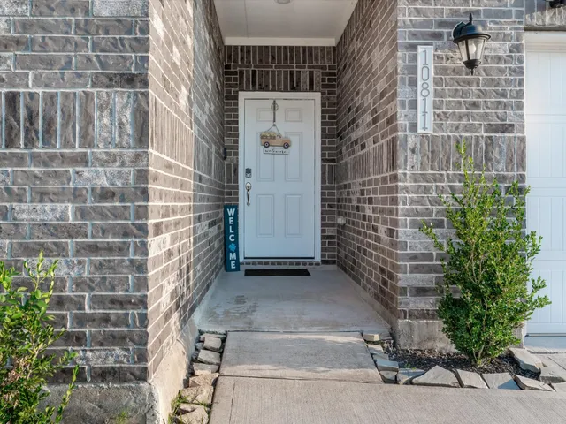 a view of a brick buildings with windows