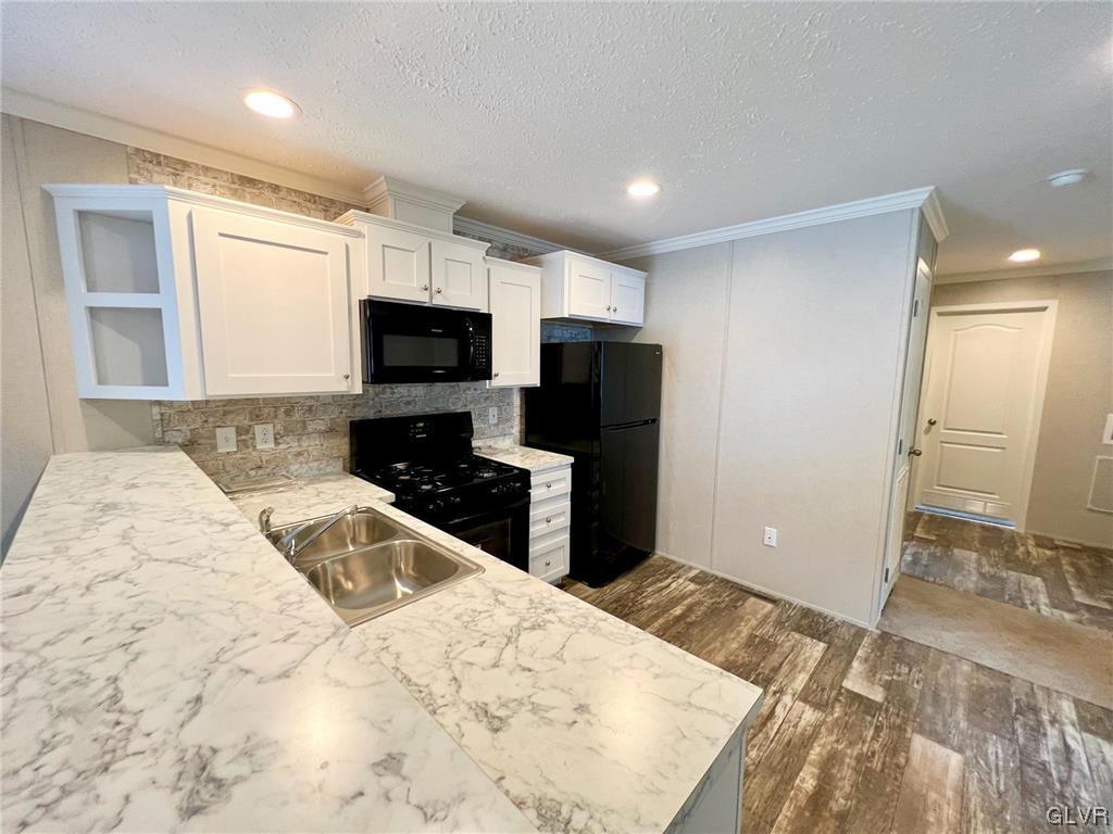 139 Country Club Road, Unit WHS108 Northampton, PA 18067 - Photo 2 of 7 a kitchen with a refrigerator and a sink
