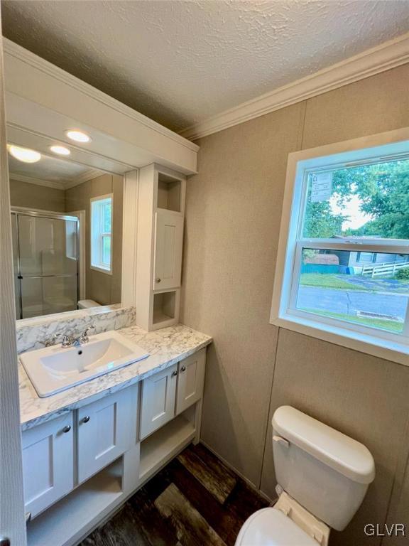 139 Country Club Road, Unit WHS108 Northampton, PA 18067 - Photo 4 of 7 a bathroom with a granite countertop toilet a sink and a large mirror