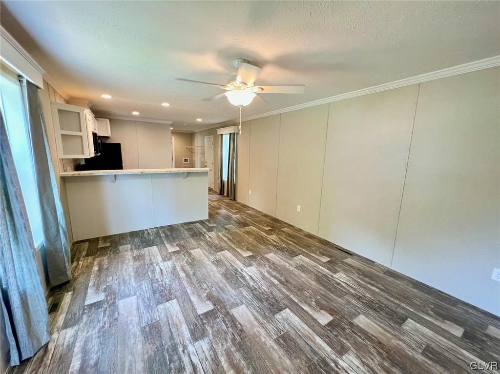 139 Country Club Road, Unit WHS108 Northampton, PA 18067 - Photo 6 of 7 a view of kitchen and empty room with wooden floor