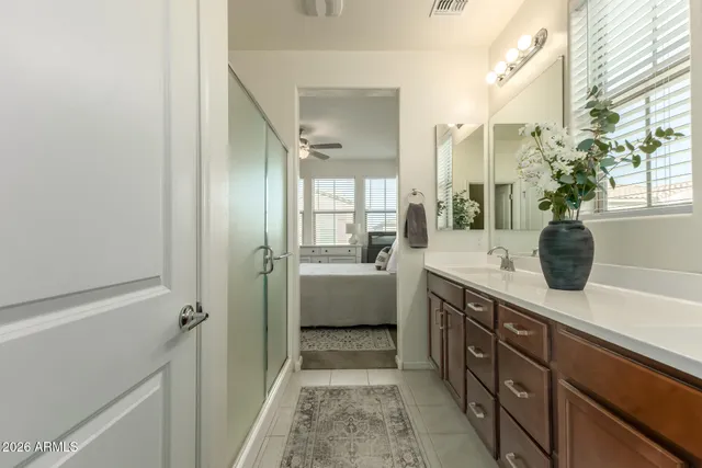 a spacious bathroom with a tub shower and sink