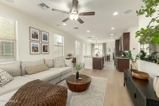 a living room with furniture and a large window