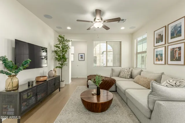 a living room with furniture and a large window