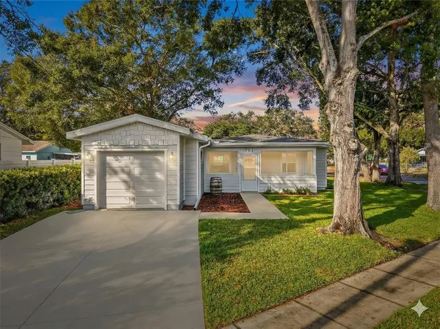 front view of a house with a yard