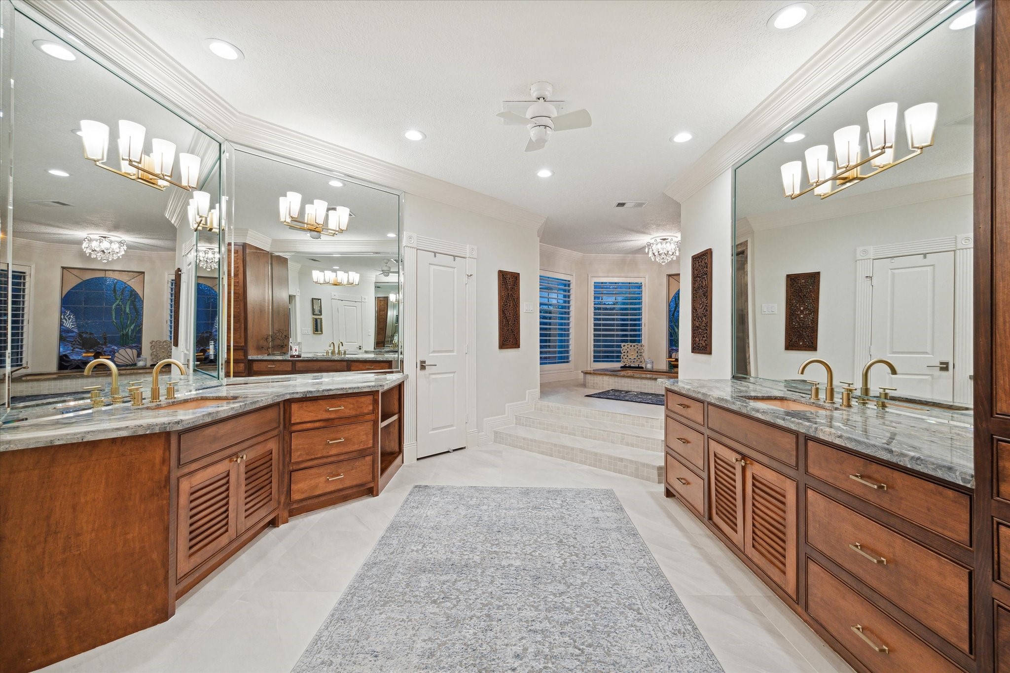 15406 Old Stone Trail Houston, TX 77079 - Photo 20 of 42 You're looking at a spacious, modern bathroom with dual vanities, ample storage, elegant granite countertops, and contemporary fixtures. The room features large mirrors, excellent lighting, and a neutral color palette that enhances the sense of space.