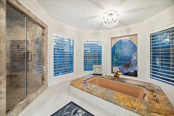 a bathroom with double vanity and a large mirror
