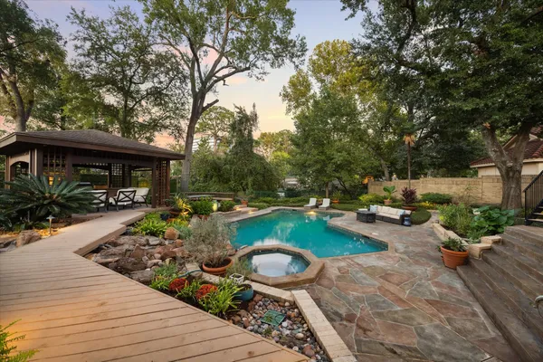a view of a swimming pool with lounge chair