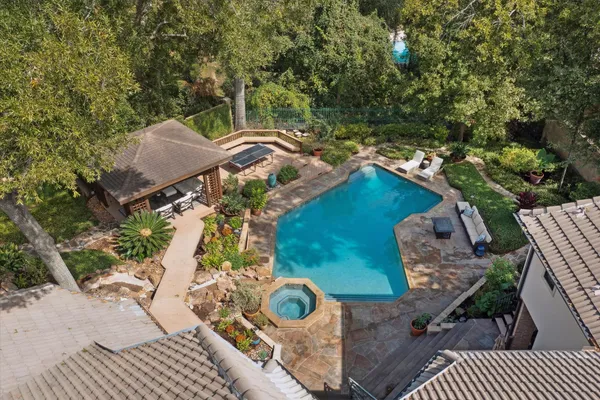an aerial view of a house with outdoor space