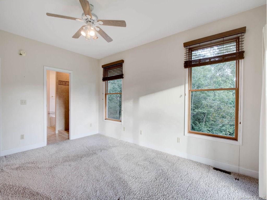 686 Fontana View Road, Unit 56 Bryson City, NC 28713 - Photo 13 of 24 a view of livingroom with window ceiling fan and hardwood floor