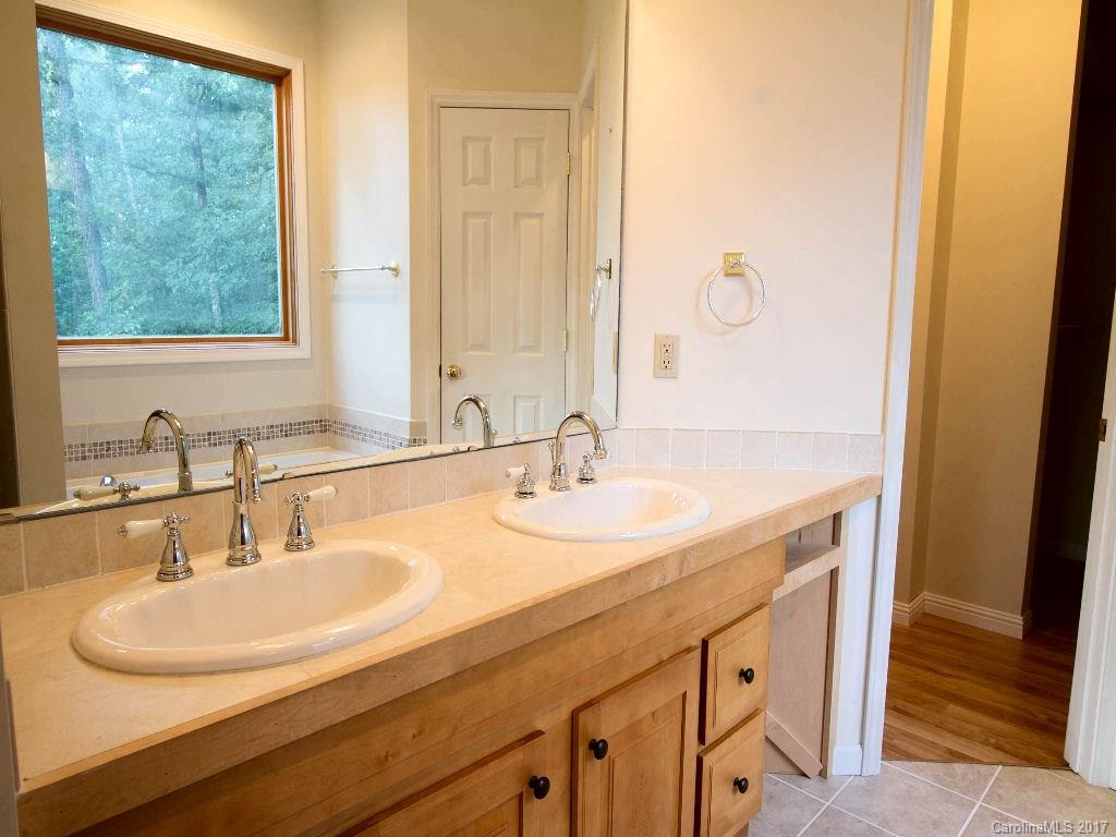 686 Fontana View Road, Unit 56 Bryson City, NC 28713 - Photo 14 of 24 a bathroom with a sink and a mirror