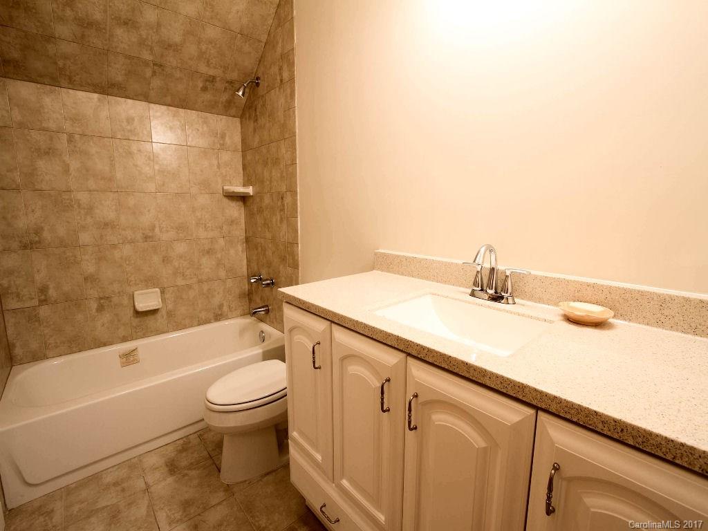 686 Fontana View Road, Unit 56 Bryson City, NC 28713 - Photo 19 of 24 a bathroom with a sink a toilet and shower