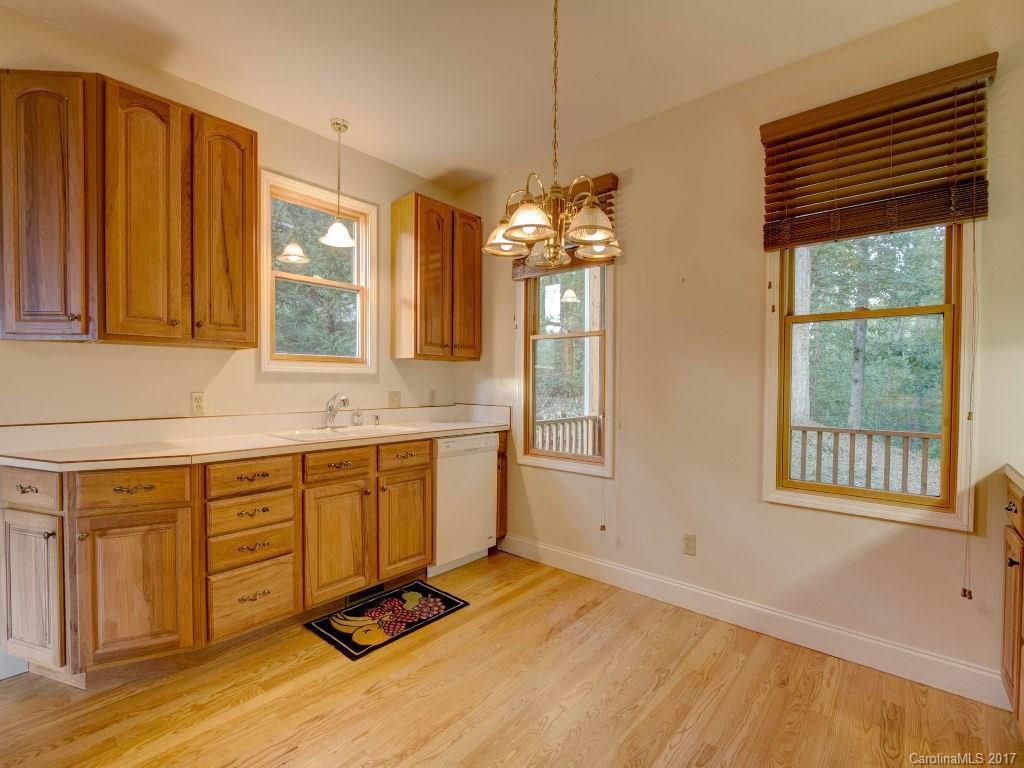 686 Fontana View Road, Unit 56 Bryson City, NC 28713 - Photo 9 of 24 a spacious bathroom with a granite countertop sink and a window