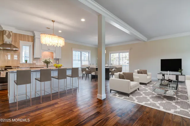 a view of a kitchen and wooden floor