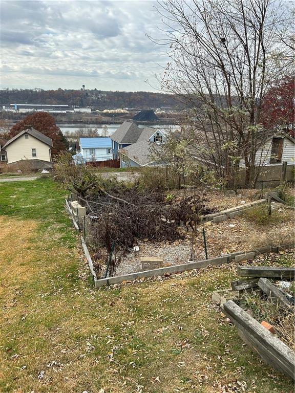 1106 8th Avenue Freedom, PA 15042 - Photo 3 of 3 a view of a yard with wooden fence