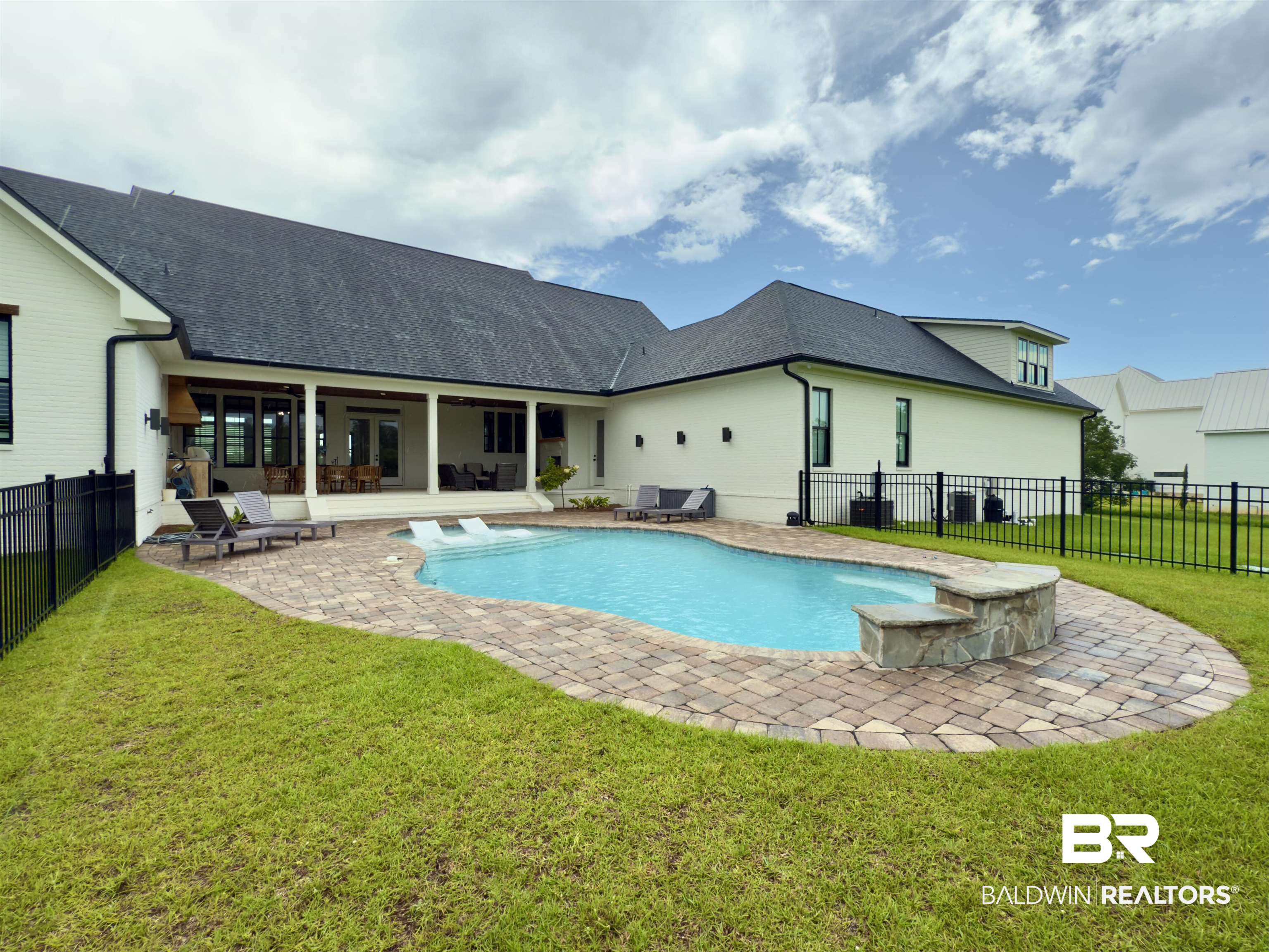21767 Gallery Boulevard Fairhope, AL 36532 - Photo 66 of 74 Back of house with a patio area, a fenced backyard, and a shingled roof