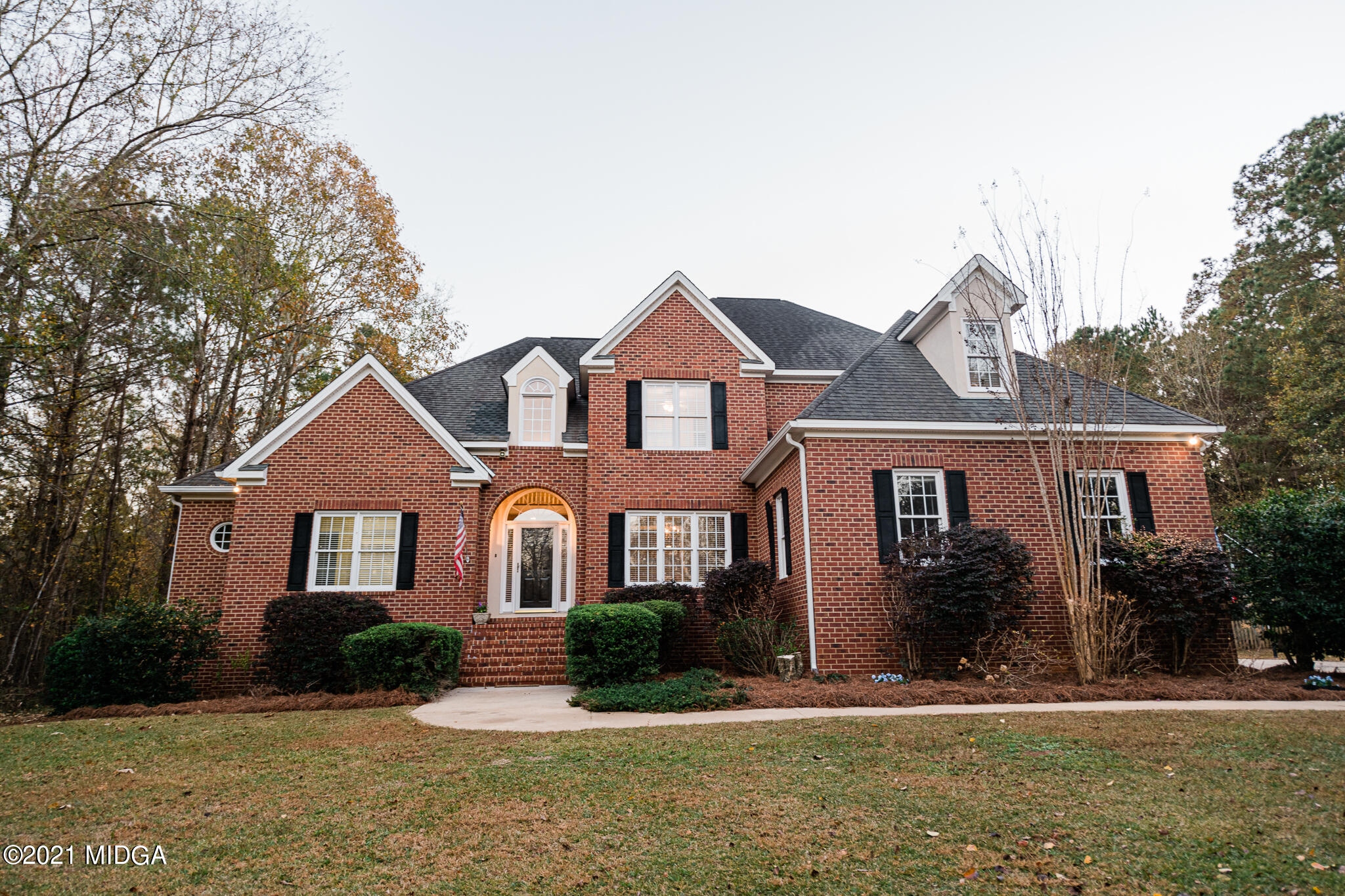 a front view of a house with a yard