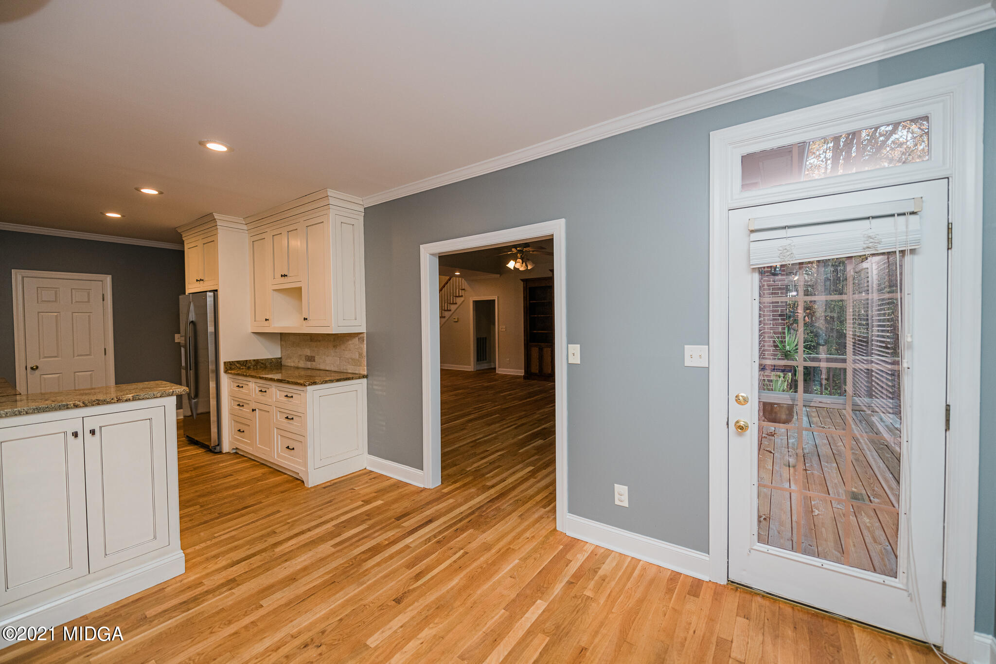 116 Hampton Ridge Road Macon, GA 31220 - Photo 22 of 77 a view of a kitchen with wooden floor and a ceiling fan