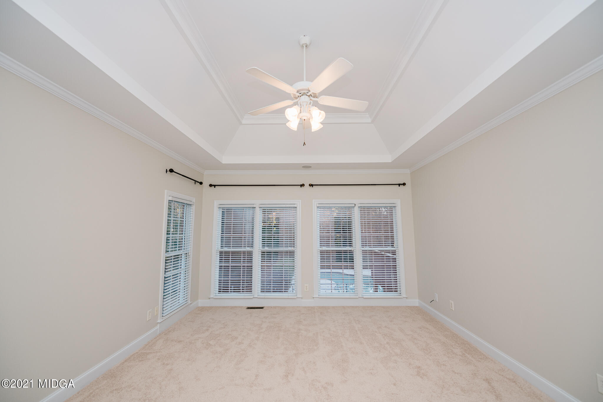 116 Hampton Ridge Road Macon, GA 31220 - Photo 24 of 77 an empty room with a ceiling fan and window