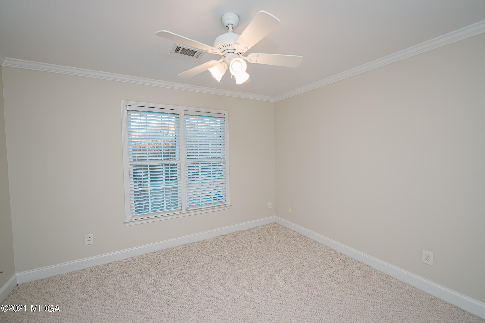 116 Hampton Ridge Road Macon, GA 31220 - Photo 34 of 77 an empty room with windows and chandelier fan