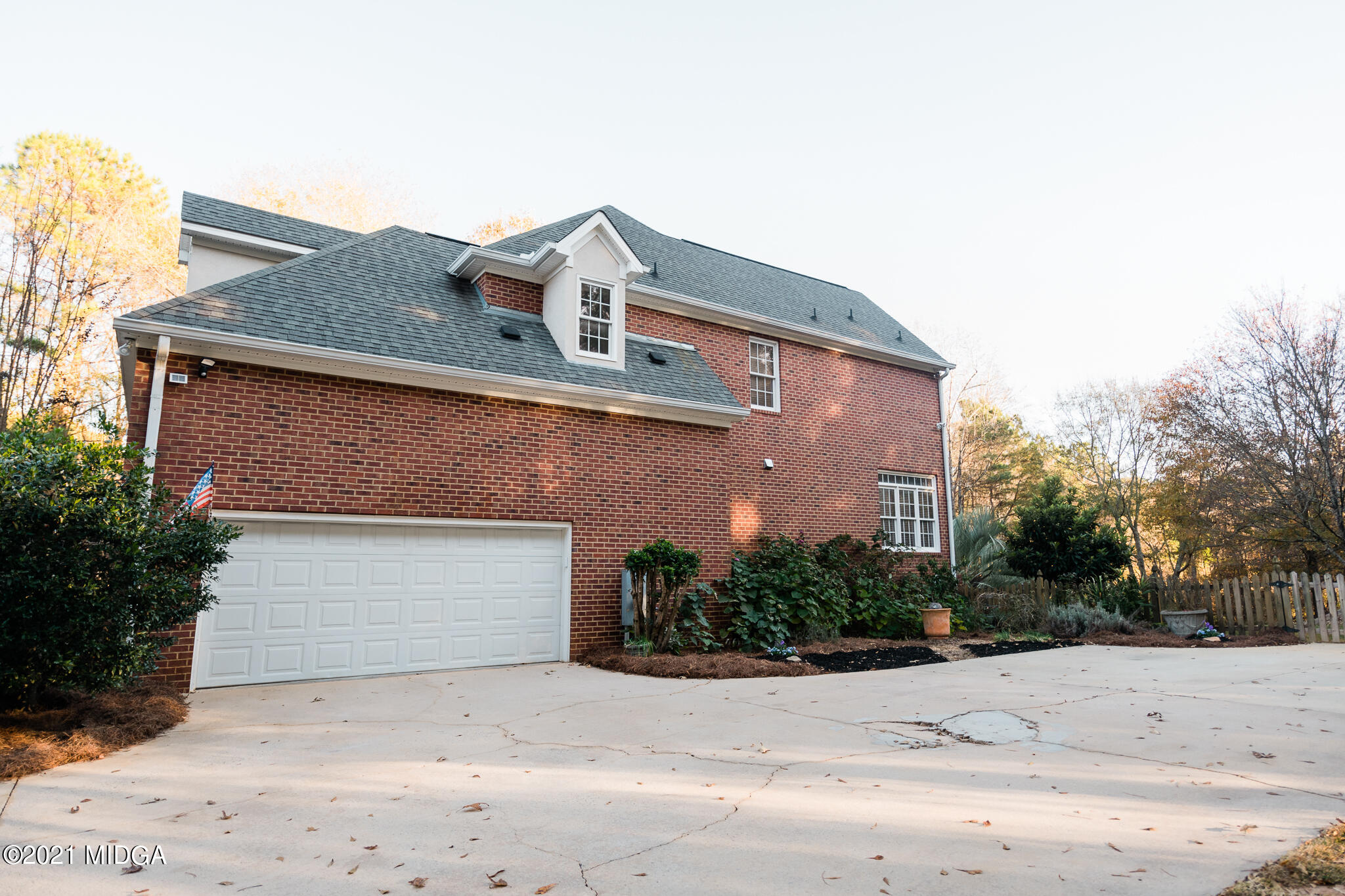 116 Hampton Ridge Road Macon, GA 31220 - Photo 6 of 77 a front view of a house with a yard and garage