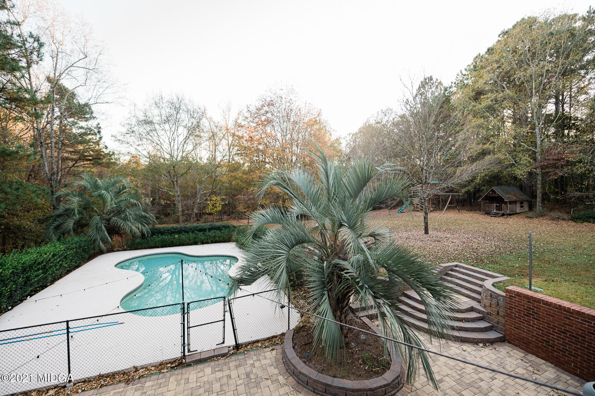 116 Hampton Ridge Road Macon, GA 31220 - Photo 73 of 77 a view of a backyard with plants and trees